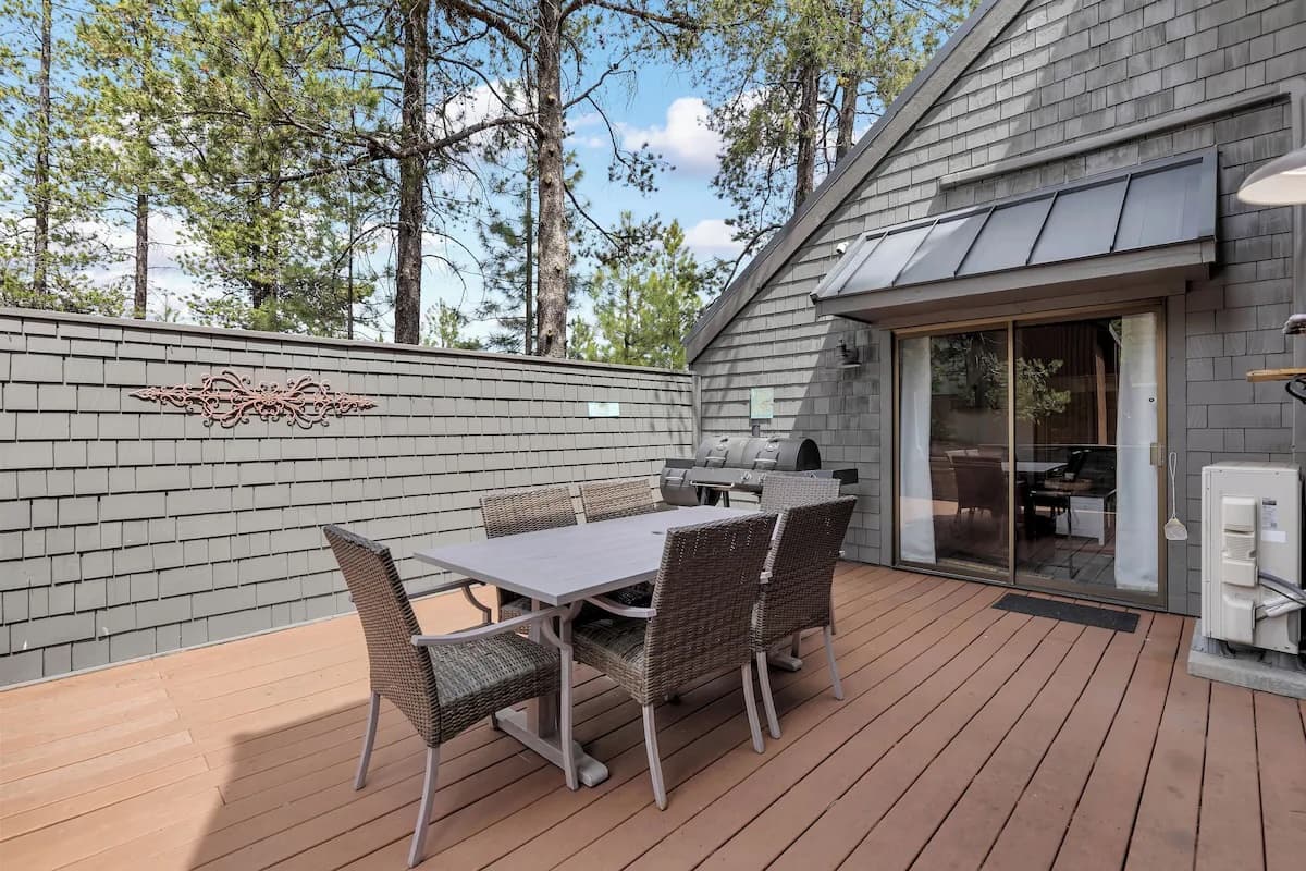 Private deck with outdoor dining table and grill